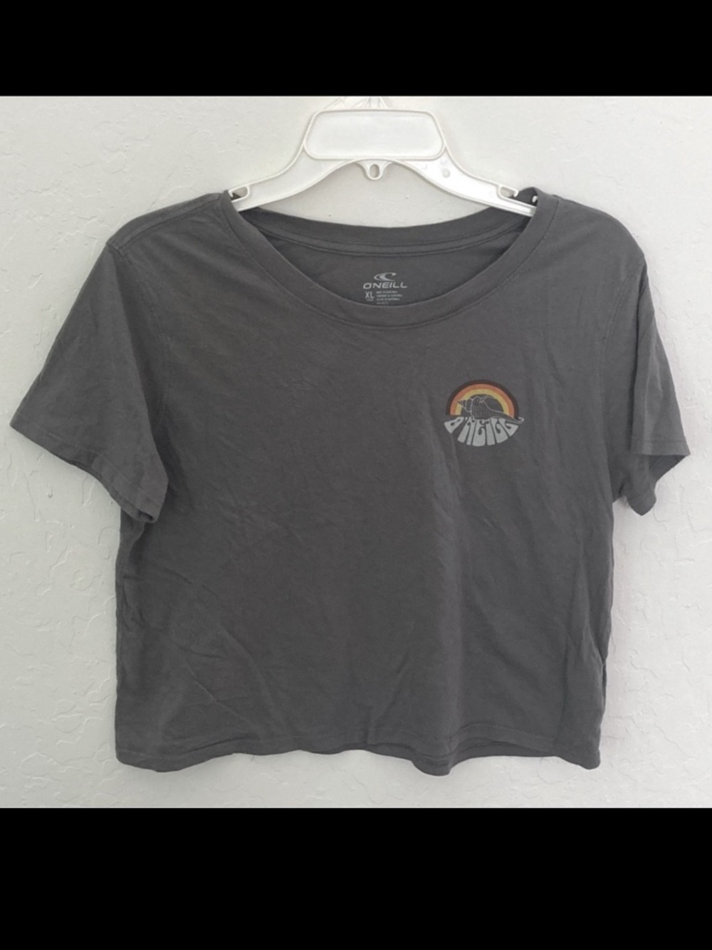 O’Neill’s t-shirt. Grey with “shelladelic” graphic. Size S (kids XL). EUC